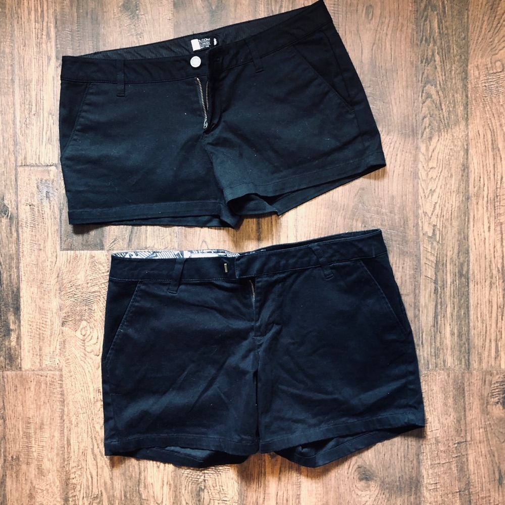2 pairs of black Volcom shorts size 9.